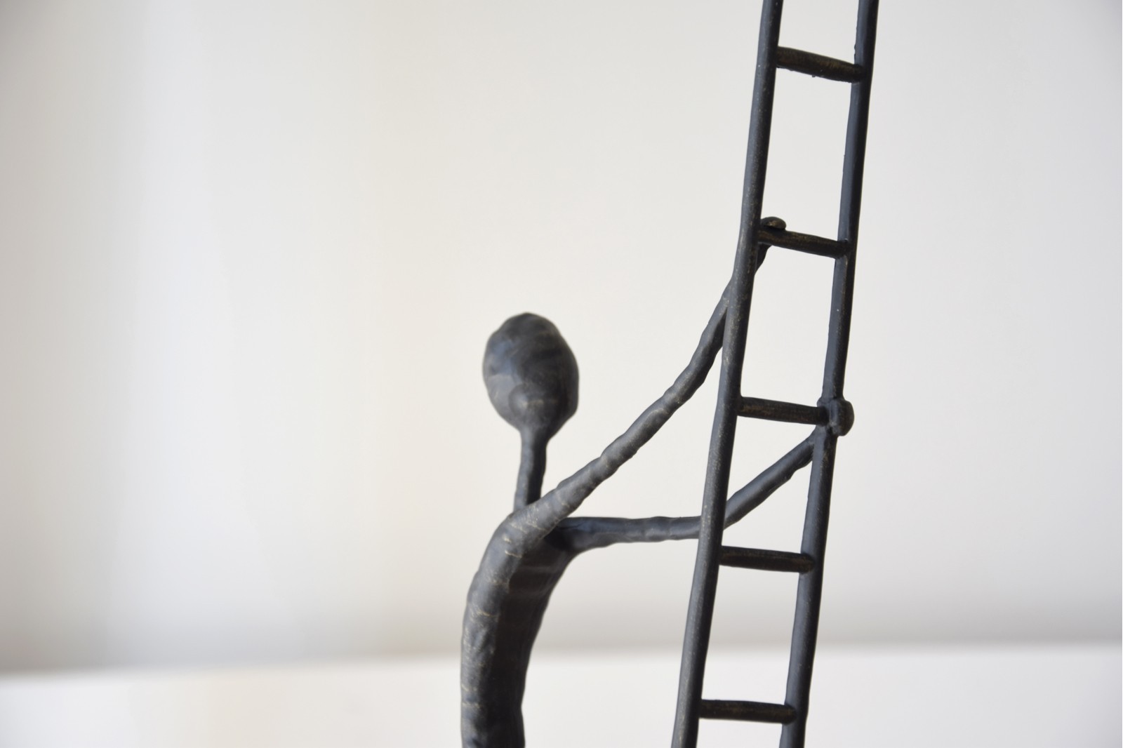 SCULPTURE CLIMBING. METAL AND MARBLE