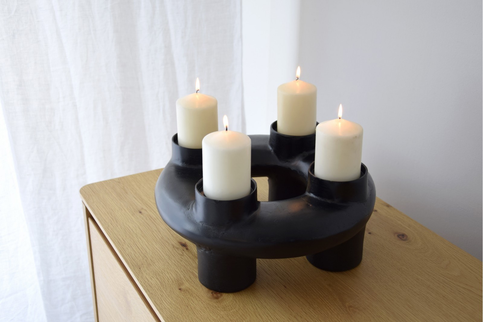 MARA CANDLE HOLDER. BLACKISH METAL