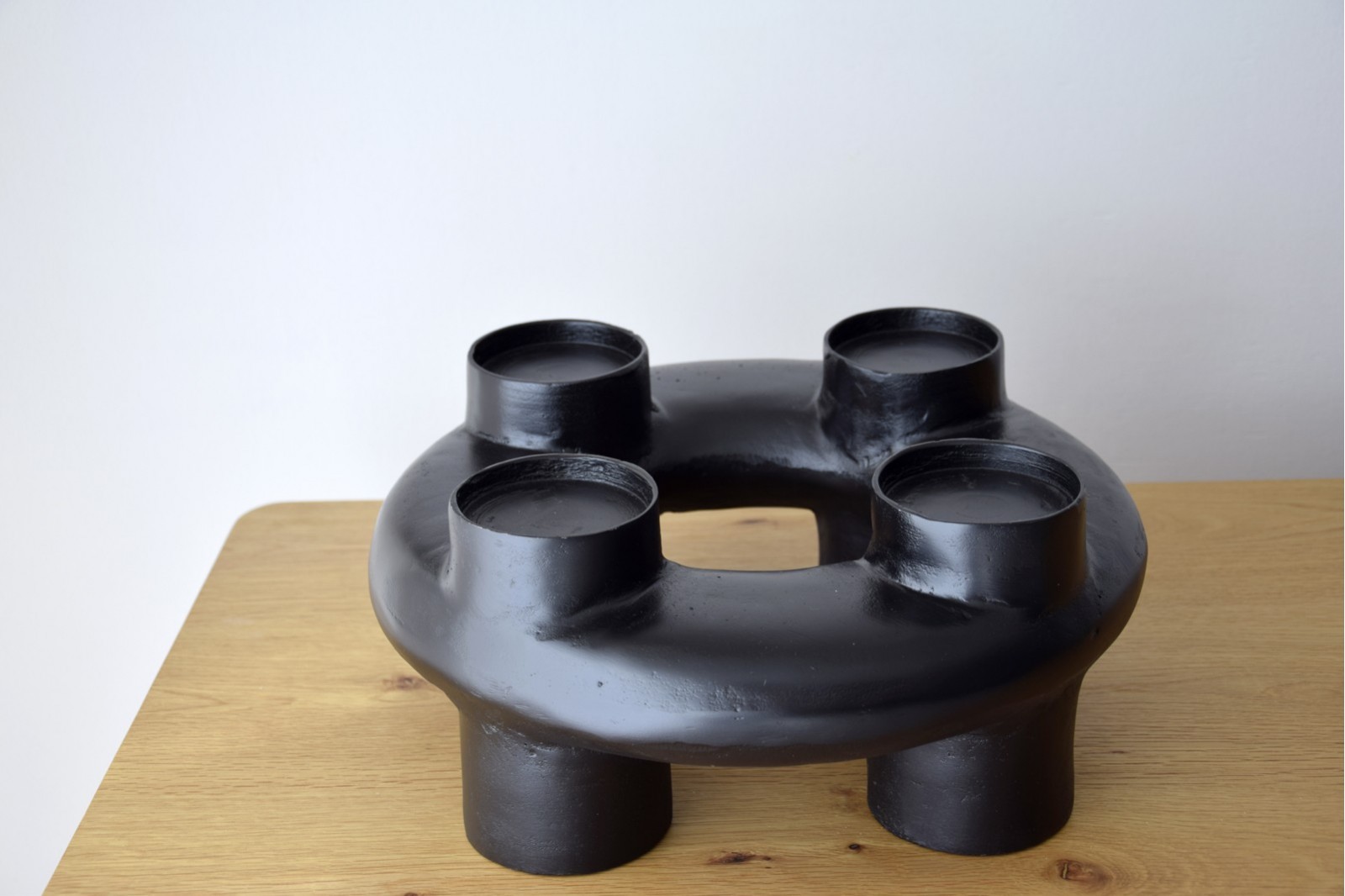 MARA CANDLE HOLDER. BLACKISH METAL