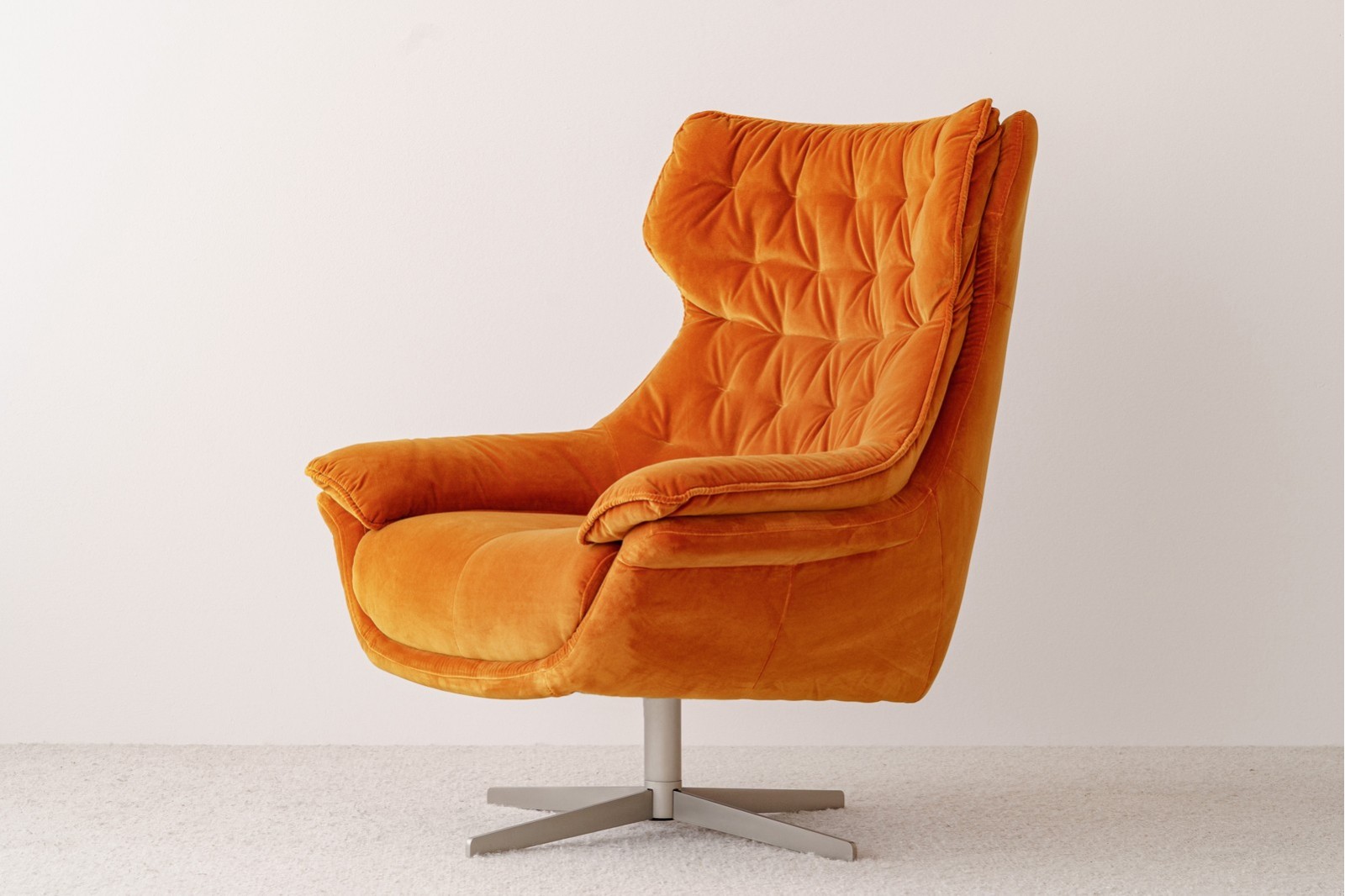 SWIVEL ARMCHAIR. ORANGE VELVET UPHOLSTERY