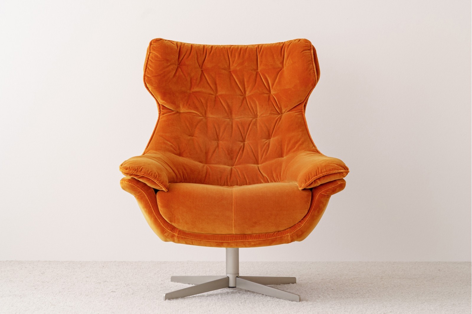 SWIVEL ARMCHAIR. ORANGE VELVET UPHOLSTERY