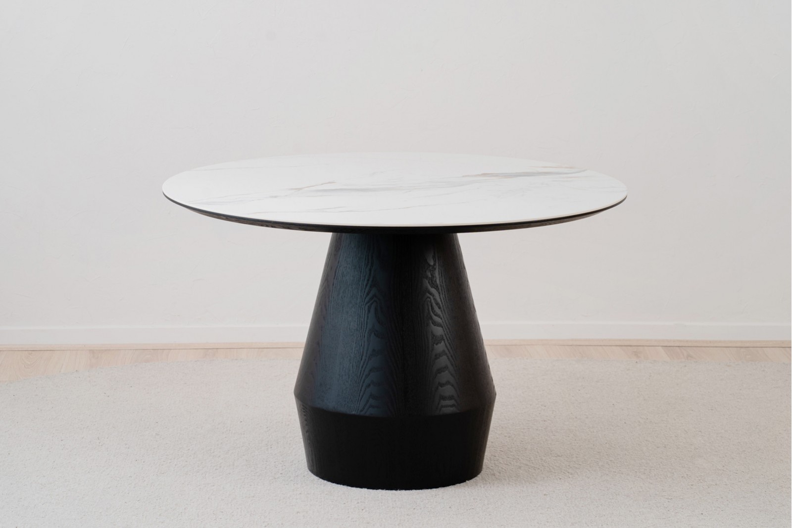 ROUND DINING TABLE. BLACK ASH AND CERAMIC