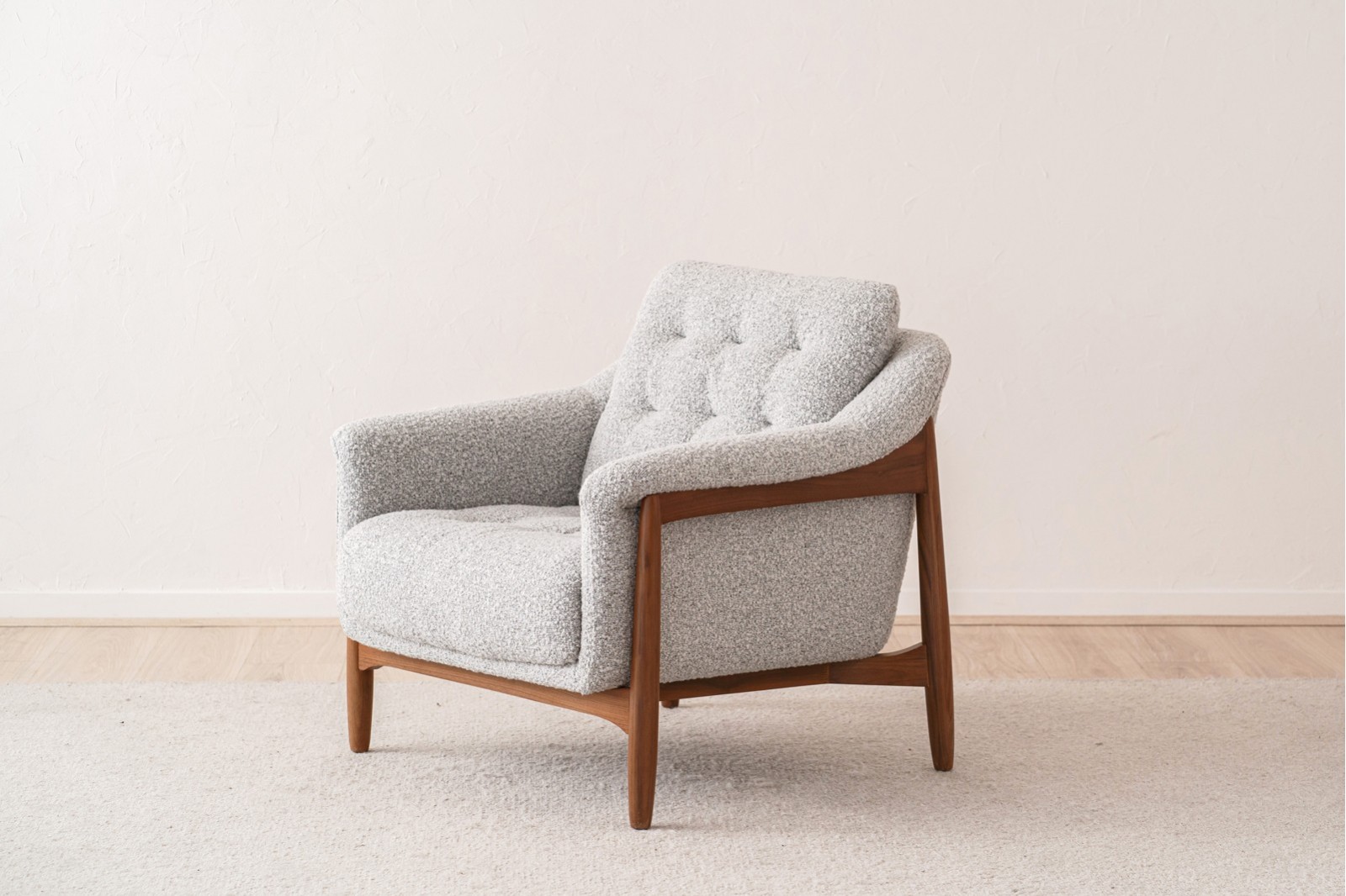 ARMCHAIR AND PUOF. WALNUT AND BOUCLE WHITE BLACK