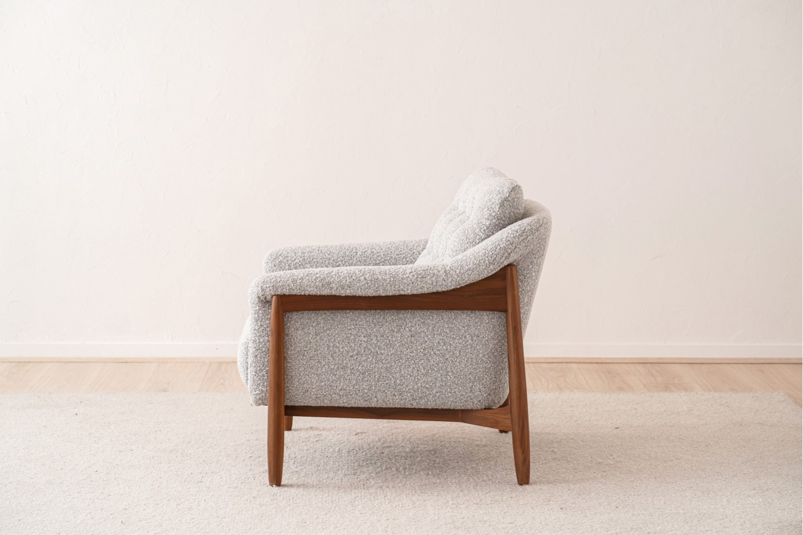 ARMCHAIR AND PUOF. WALNUT AND BOUCLE WHITE BLACK