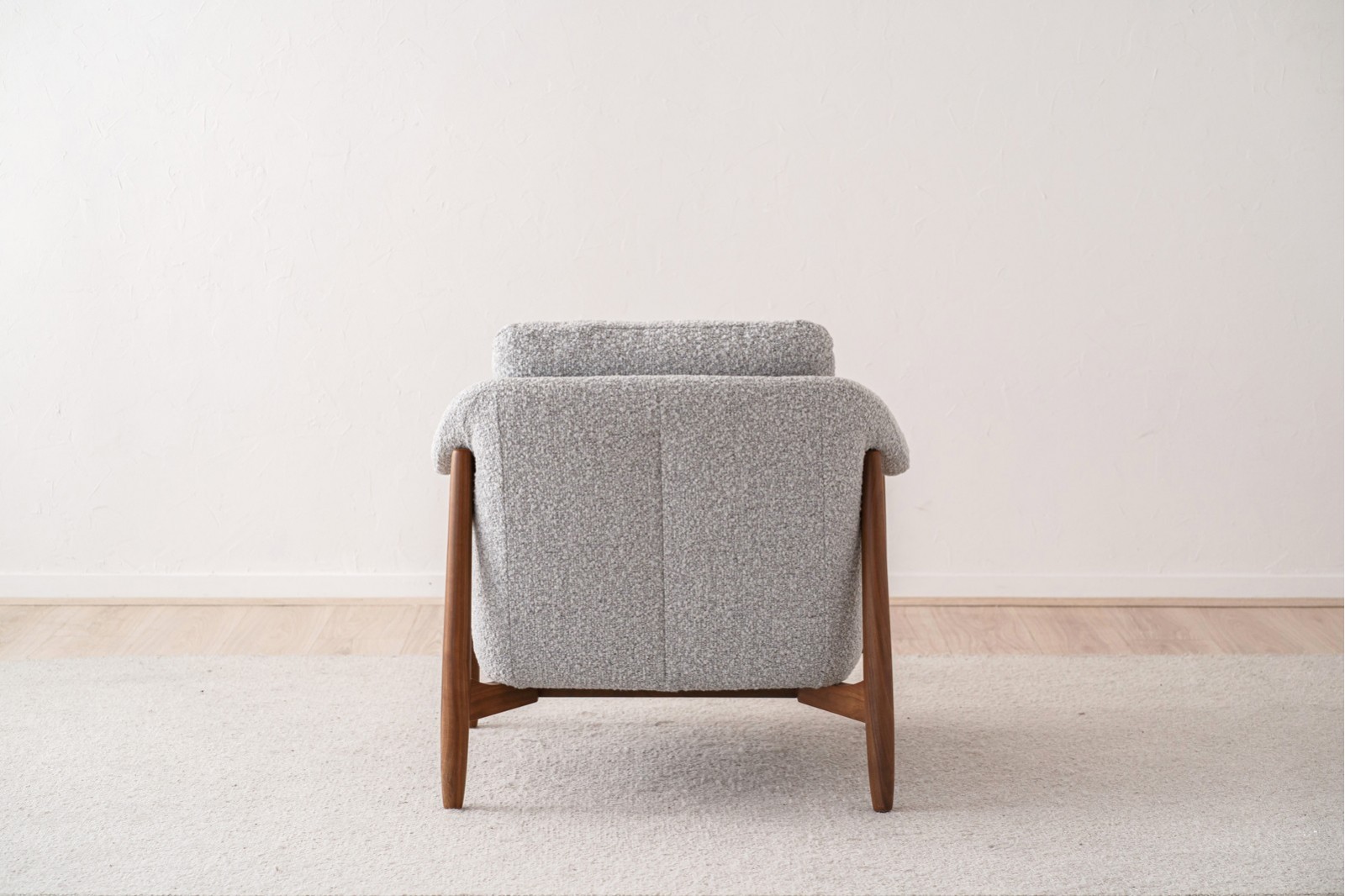 ARMCHAIR AND PUOF. WALNUT AND BOUCLE WHITE BLACK