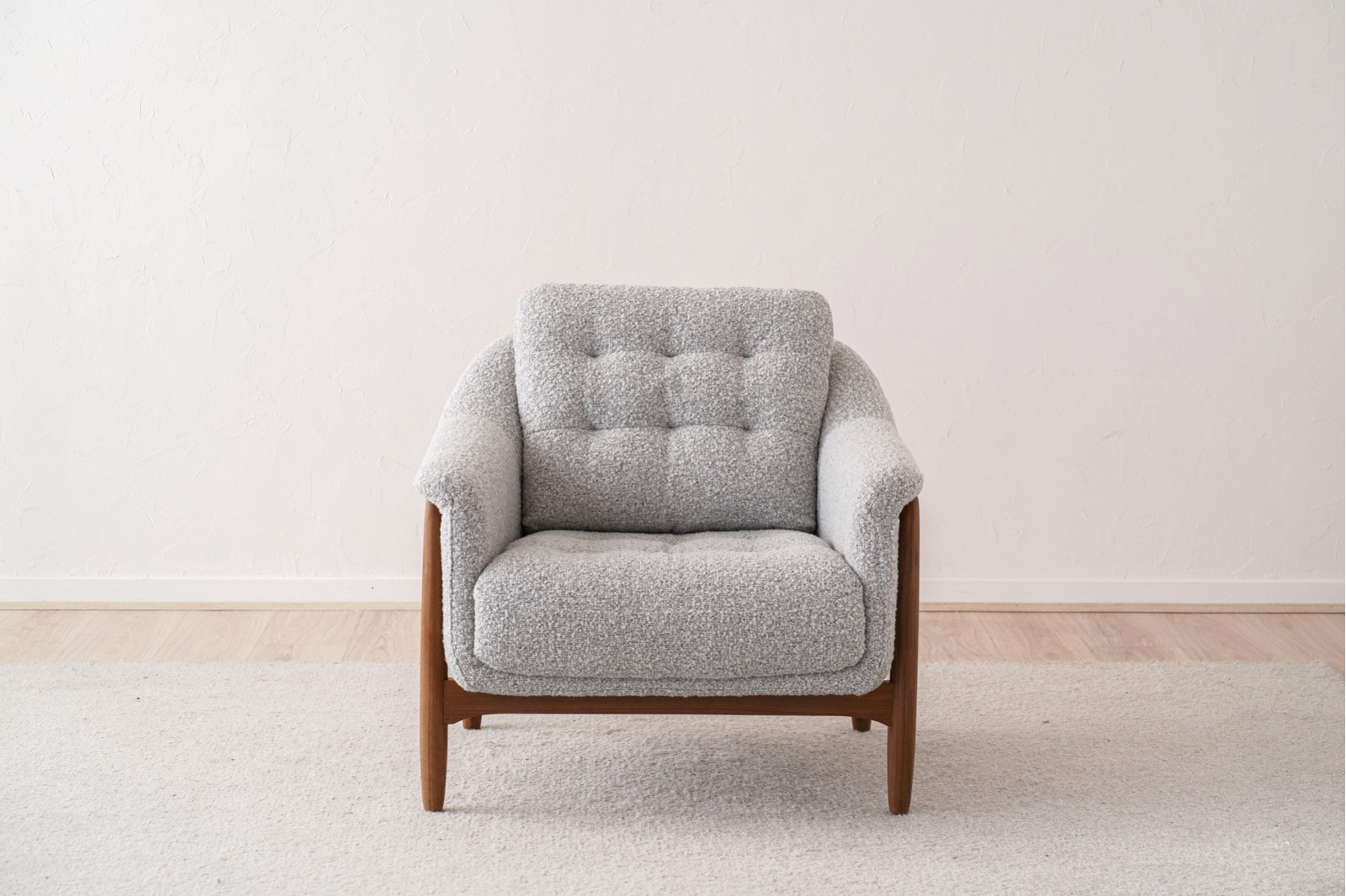 ARMCHAIR AND PUOF. WALNUT AND BOUCLE WHITE BLACK