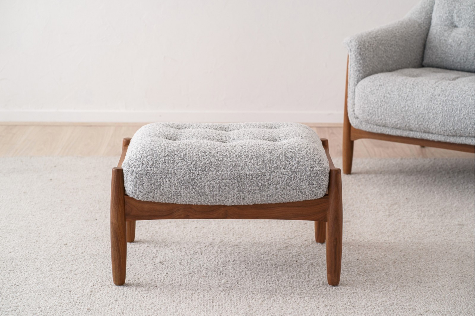ARMCHAIR AND PUOF. WALNUT AND BOUCLE WHITE BLACK